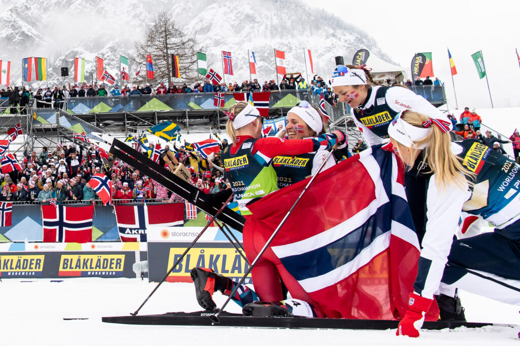 Anne Kjersti Kalvå celebrate with Ingvild Flugstad Østberg, Tiril Udnes Weng and Astrid Slind Øyre of Norway as she crosses the finish line and win gold for Norway in the Women's Cross Country Skiing 4 x 5km Relay during the FIS Nordic Ski World Championships on March 2, 2023 in Planica.