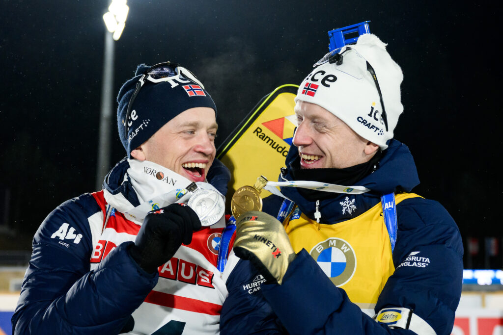 Tarjei Bø of Norway and Johannes Thingnes Bø of Norway celebrate after men's 20 km individual during the IBU Biathlon World Championships on February 14, 2024 in Nove Mesto na Morave.