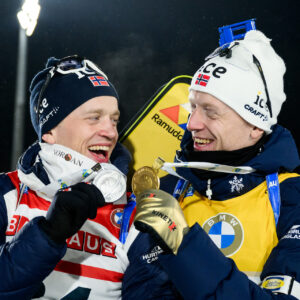 Tarjei Bø of Norway and Johannes Thingnes Bø of Norway celebrate after men's 20 km individual during the IBU Biathlon World Championships on February 14, 2024 in Nove Mesto na Morave.