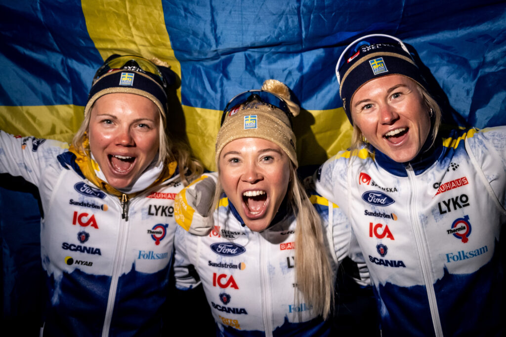 Emma Ribom (silver) Jonna Sundling (gold) and Maja Dahlqvist (bronze) of Sweden celebrate after Women's Cross Country Skiing Sprint final during the FIS Nordic Ski World Championships on February 23, 2023 in Planica.